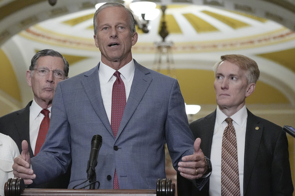 Sen. Majority Leader John Thune, R-S.D., center, speaks as Sen. John Barrasso, R-Wyo., left and Sen. James Lankford, R-Okla., right, listen during a news conference after a policy luncheon on Capitol Hill,Tuesday, June 9, 2026, in Washington. (AP Photo/Mariam Zuhaib)