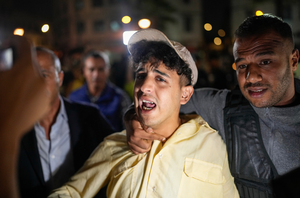 A boy is detained while taking part in a youth led protest calling for education and health reforms, in Casablanca, Morocco, Monday, Sept. 29, 2025. (AP Photo/Mosa'ab Elshamy)