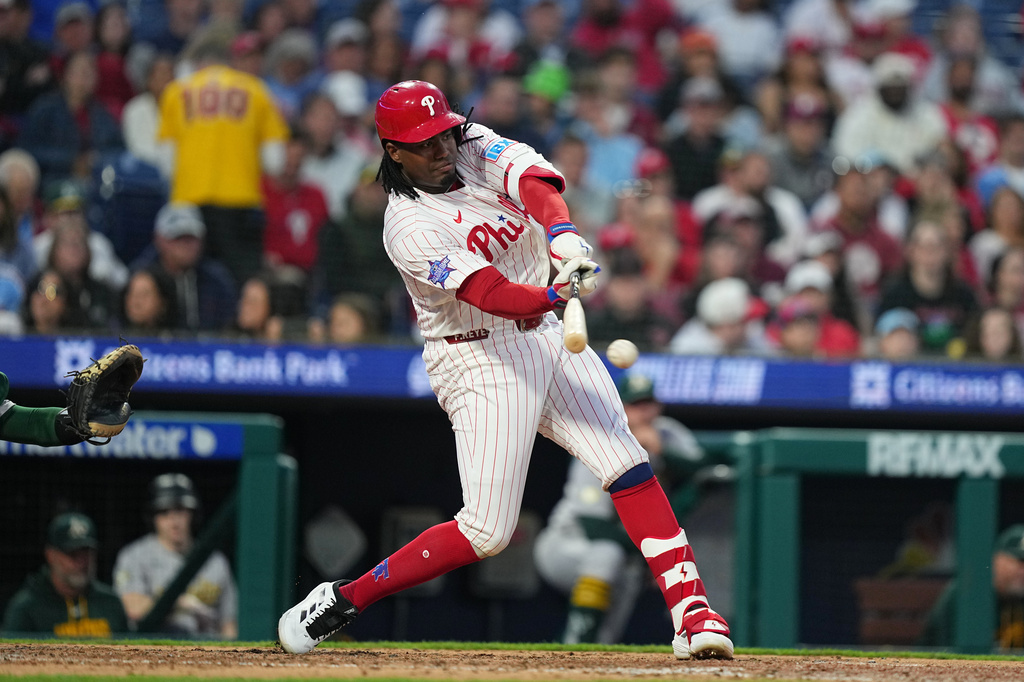 Philadelphia Phillies' Felix Reyes hits a one-run single off of Athletics pitcher Jeffrey Springs during the fifth inning of a baseball game, Wednesday, May 6, 2026, in Philadelphia. (AP Photo/Matt Rourke)