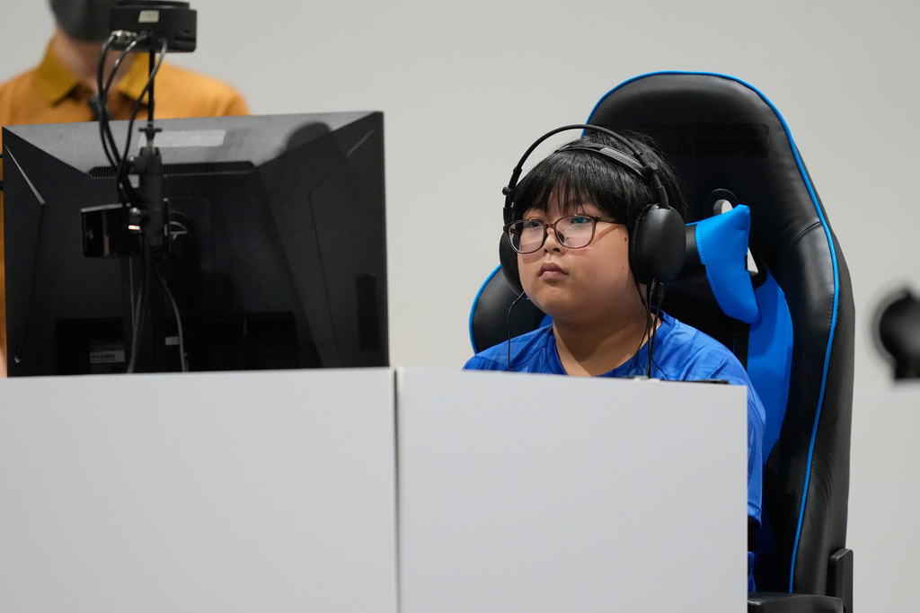 Japan's Yuki Kurihara competes against Kang Dong-shin of South Korea during the Puyo Puyo Champions esports final at the Asian Games in Nagoya, Japan, Saturday, Sept. 26, 2026. (AP Photo/Dita Alangkara)