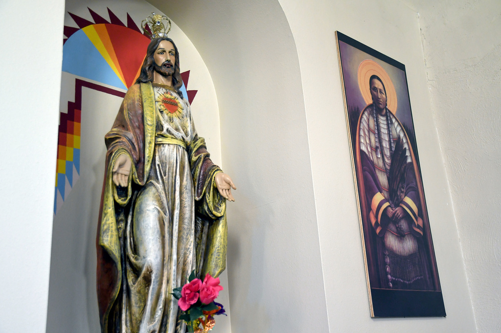 Native American imagery is displayed at the St. Stephens Indian Mission Catholic church in Arapahoe, Wyo., on Monday, Aug. 17, 2026. (AP Photo/Thomas Peipert)