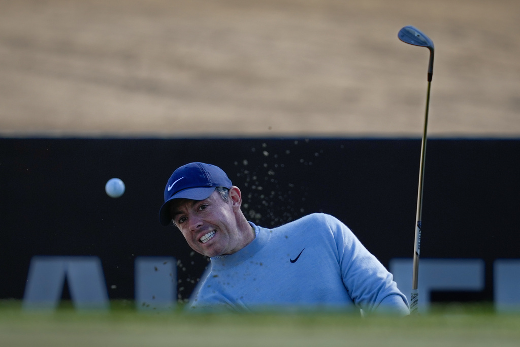 Rory McIlroy of Northern Ireland hits a shot from a bunker on the 15th hole during first round of the Dubai Desert Classic in United Arab Emirates, Thursday, Jan. 22, 2026. (AP Photo/Altaf Qadri)