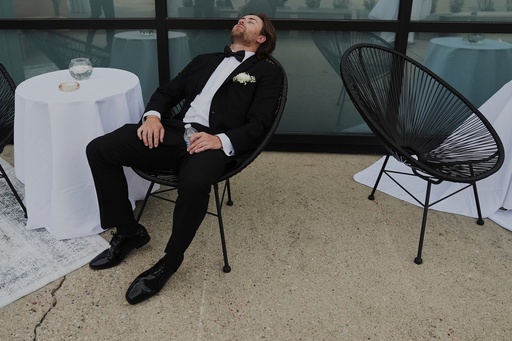 FILE - A Groomsman takes a break after finishing bridal party photos at a wedding on Saturday, Aug. 23, 2025, in Newtown, Ohio. (AP Photo/Joshua A. Bickel, File) FILE - A Groomsman takes a break after finishing bridal party photos at a wedding on Saturday, Aug. 23, 2025, in Newtown, Ohio. (AP Photo/Joshua A. Bickel, File)
