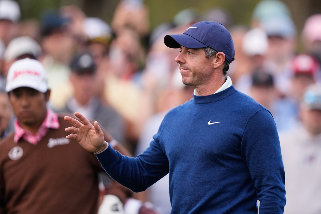 Rory McIlroy of Northern Ireland acknowledges fans appluase before hitting off the 10th tee during the second round of The Players Championship golf tournament Friday, March 13, 2026, in Ponte Vedra Beach, Fla. (AP Photo/Gerald Herbert)