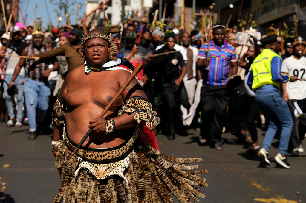 FILE -A protester dressed traditional attire marches against illegal immigration, in Johannesburg, South Africa, June 30, 2026. (AP Photo/Themba Hadebe, File)