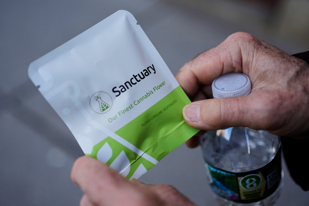 A customer holds a gram of cannabis purchased from a dispensary on Friday, Nov. 14, 2025, in Brookline, Mass. (AP Photo/Robert F. Bukaty)