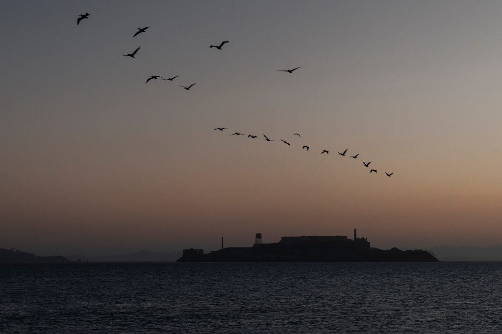Alcatraz Island is seen at sunrise in San Francisco, Wednesday, July 15, 2026, a day after a boat named Volare capsized in rough seas near the island. (Stephen Lam/San Francisco Chronicle via AP)