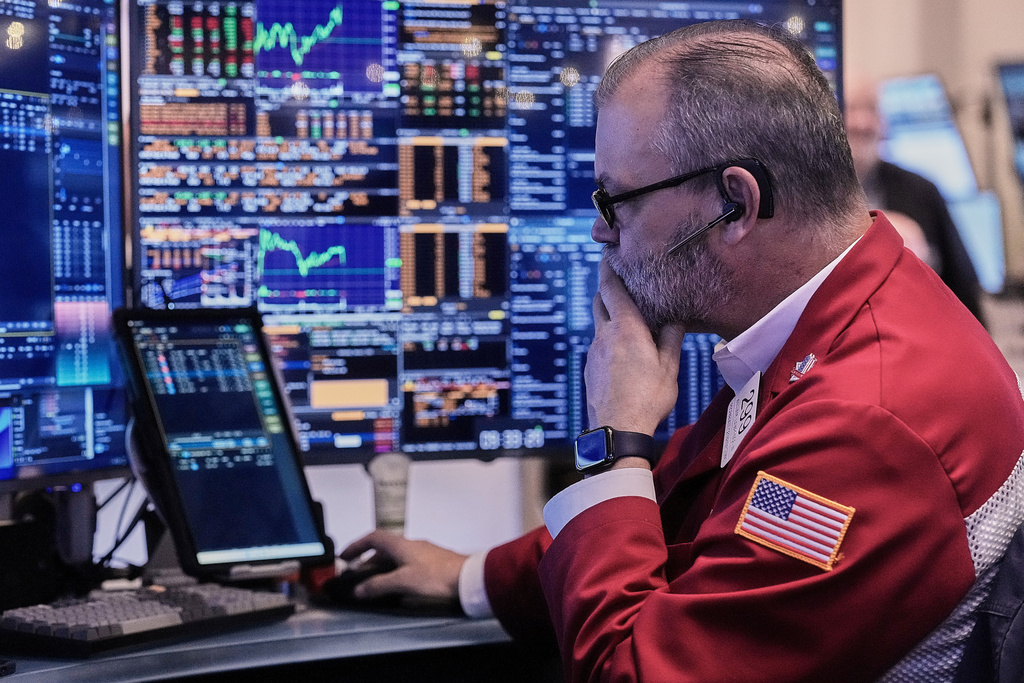 Trader William Lawrence works on the floor of the New York Stock Exchange, Wednesday, Jan. 7, 2026. (AP Photo/Richard Drew)