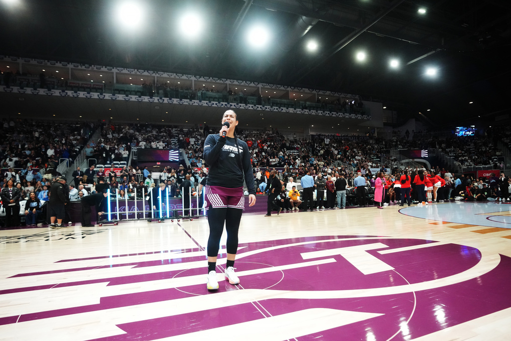 Toronto Tempo's Kia Nurse, foreground, speaks to the home crowd prior to WNBA basketball game action against the Washington Mystics in Toronto, Friday, May 8, 2026. (Nathan Denette/The Canadian Press via AP)