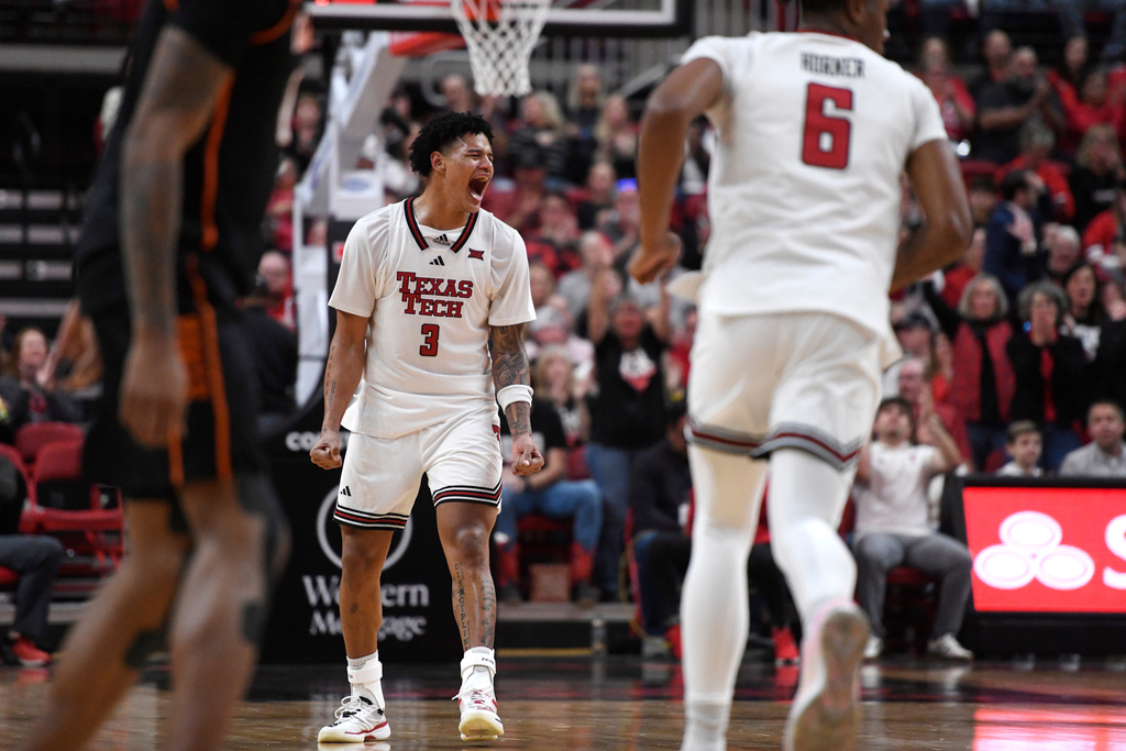 Texas Tech forward Lejuan Watts (3) reacts to his three-pointer during the first half in an NCAA college basketball game against Oklahoma State, Saturday, Jan. 3, 2026, in Lubbock, Texas. (AP Photo/Annie Rice)