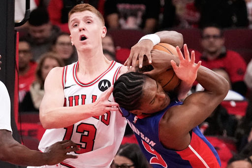 Chicago Bulls guard/forward Kevin Huerter, left, and Detroit Pistons guard/forward Ausar Thompson battle for a loose ball during the first half of an NBA basketball game in Chicago, Wednesday, Oct. 22, 2025. (AP Photo/Nam Y. Huh) Chicago Bulls guard/forward Kevin Huerter, left, and Detroit Pistons guard/forward Ausar Thompson battle for a loose ball during the first half of an NBA basketball game in Chicago, Wednesday, Oct. 22, 2025. (AP Photo/Nam Y. Huh)