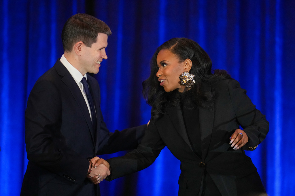 Texas state Rep. James Talarico, D-Austin, left, shakes hands with Rep. Jasmine Crockett, D-Texas, prior a debate during the Texas AFL-CIO Committee on Political Education Convention, Saturday, Jan. 24, 2026, in Georgetown, Texas. (Bob Daemmrich/Texas Tribune via AP, Pool)