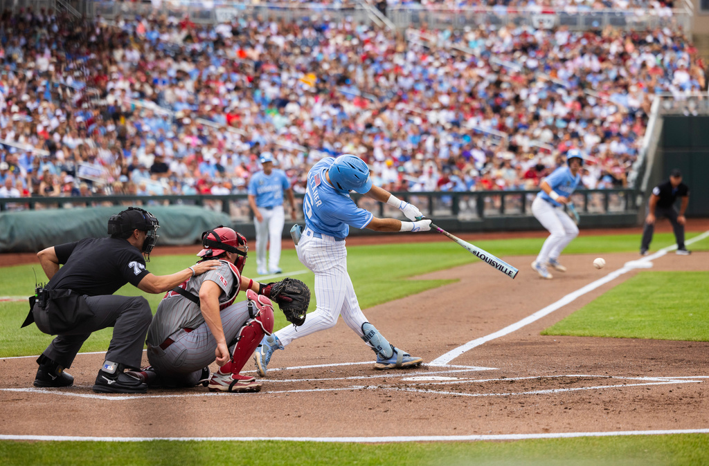 North Carolina's Gavin Gallaher (5) drives in two runs during in the first inning against Oklahoma in Game 1 of the NCAA College World Series baseball finals in Omaha, Neb., Saturday, June 20, 2026. (AP Photo/Rebecca S. Gratz)