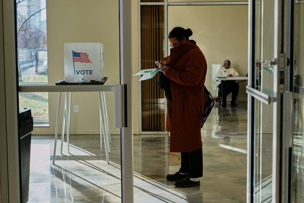 People wait to cast their ballot at the Horatio Williams Foundation in downtown Detroit, Tuesday, Nov. 4, 2025. (AP Photo/Ryan Sun)