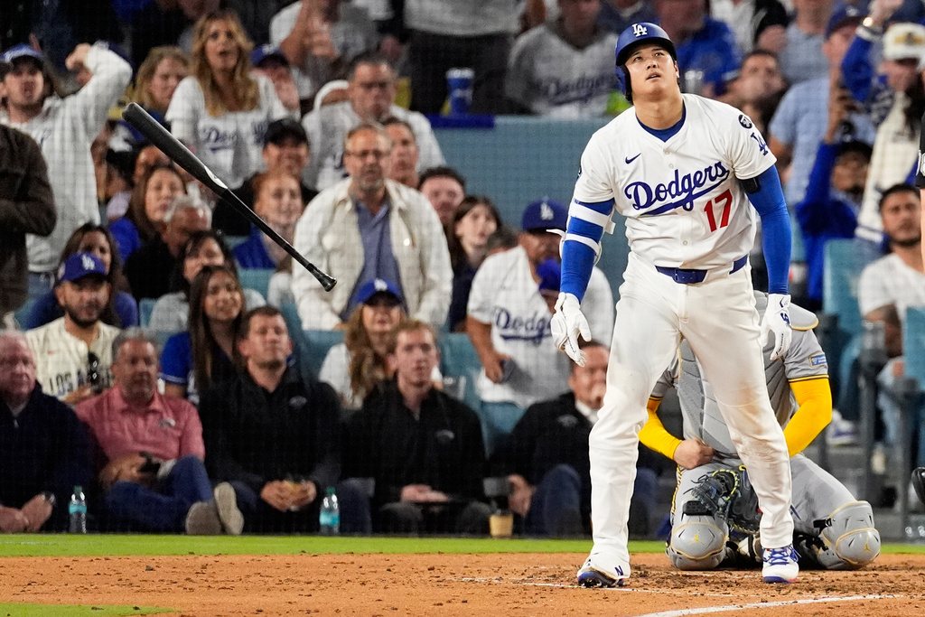 Los Angeles Dodgers' Shohei Ohtani watches his home run against the Milwaukee Brewers during the fourth inning in Game 4 of baseball's National League Championship Series, Friday, Oct. 17, 2025, in Los Angeles. (AP Photo/Mark J. Terrill)