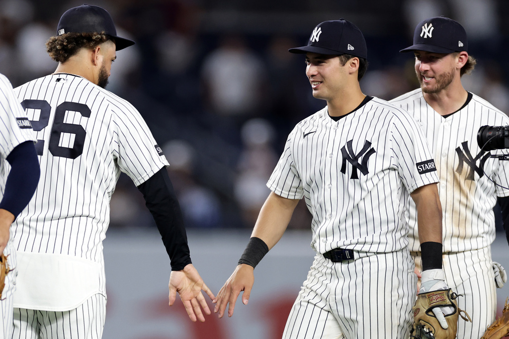 New York Yankees' Anthony Volpe celebrates with teammate after defeating the Colorado Rockies in a baseball game, Thursday, Sept. 10, 2026, in New York. (AP Photo/Adam Hunger)