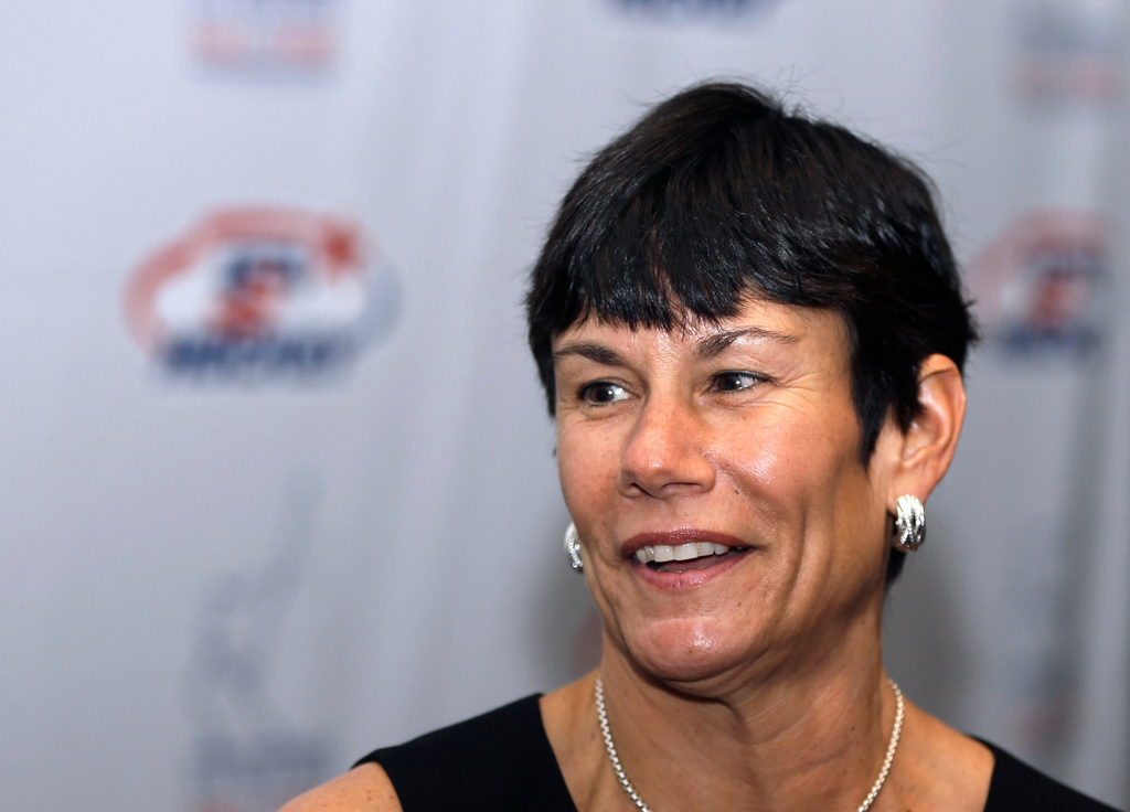 FILE - Cindy Curley addresses the media before her induction into the United States Hockey Hall of Fame in Detroit, Dec. 2, 2013. (AP Photo/Carlos Osorio, File)