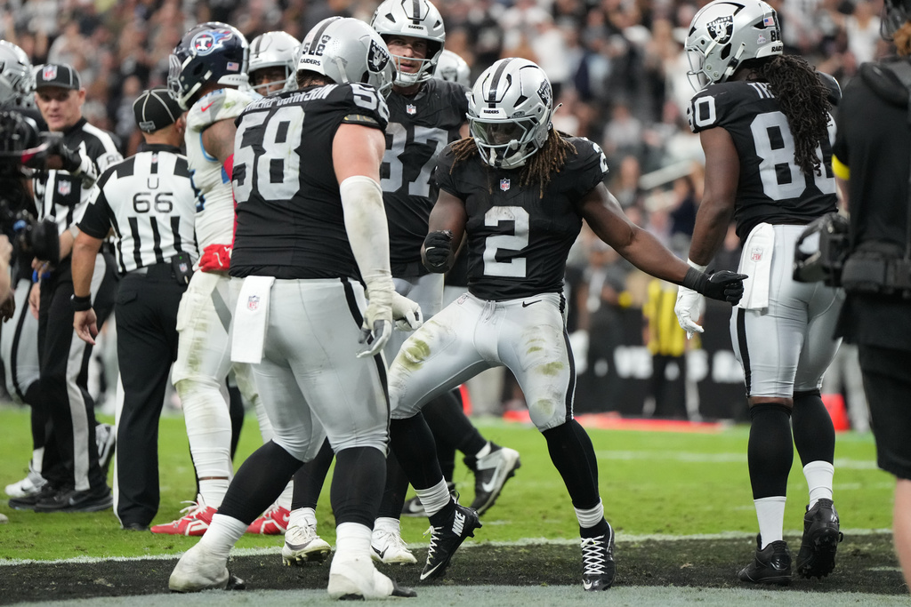 Las Vegas Raiders running back Ashton Jeanty (2) celebrates after scoring a touchdown against the the Tennessee Titans during the second half of an NFL football game, Sunday, Oct. 12, 2025, in Las Vegas. (AP Photo/Rick Scuteri)