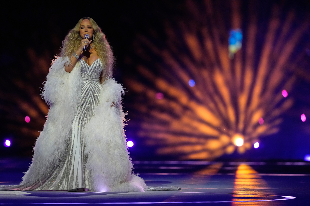 Singer Mariah Carey performs during the Olympic opening ceremony at the 2026 Winter Olympics, in Milan, Italy, Friday, Feb. 6, 2026. (AP Photo/Natacha Pisarenko)