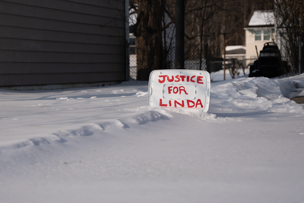 A sign reading "Justice for Linda" is seen in a yard near the home of William Stevenson, the ex-husband of former first lady Jill Biden, in Wilmington, Del., Tuesday, Feb. 3, 2026. (AP Photo/Mingson Lau)