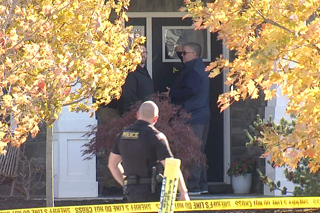 In this image from video provided by WRTV, investigators work at the site of the fatal shooting of house cleaner Maria Florinda Rios Perez De Velasquez who went to the wrong address in Whitestown, Ind., on Wednesday, Nov. 5, 2025. (WRTV via AP)