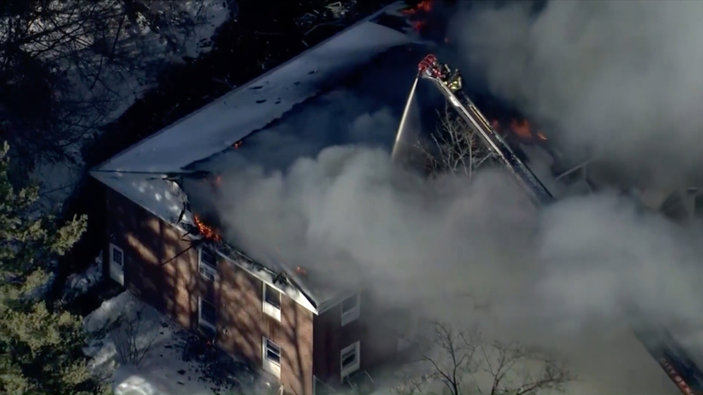 This image made from video provided by WCVB-TV shows an ongoing fire following a natural gas explosion inside a building in Nashua, N.H., Monday Feb. 2, 2026. (WCVB-TV via AP)