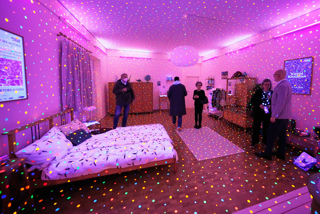 People view the art installation 'I'm here - but Nothing' during a preview of the new major exhibition of legendary Japanese artist Yayoi Kusama at the Museum Ludwig in Cologne, Thursday, March 12, 2026. (AP Photo/Martin Meissner)