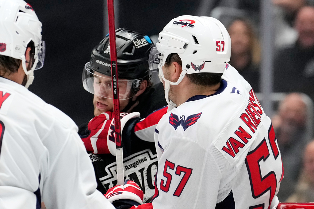 Washington Capitals defenseman Trevor van Riemsdyk, right, scuffles with Los Angeles Kings right wing Alex Laferriere during the second period of an NHL hockey game Tuesday, Dec. 2, 2025, in Los Angeles. (AP Photo/Mark J. Terrill)