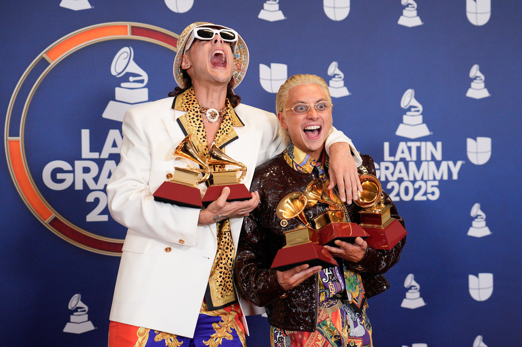 FILE - Ca7riel, left, and Paco Amoroso pose in the press room with the awards for best long and short form music video, best pop song , best alternative music video and best alternative song during the 2025 Latin Grammys on Nov. 13, 2025, in Las Vegas. (AP Photo/John Locher, File)