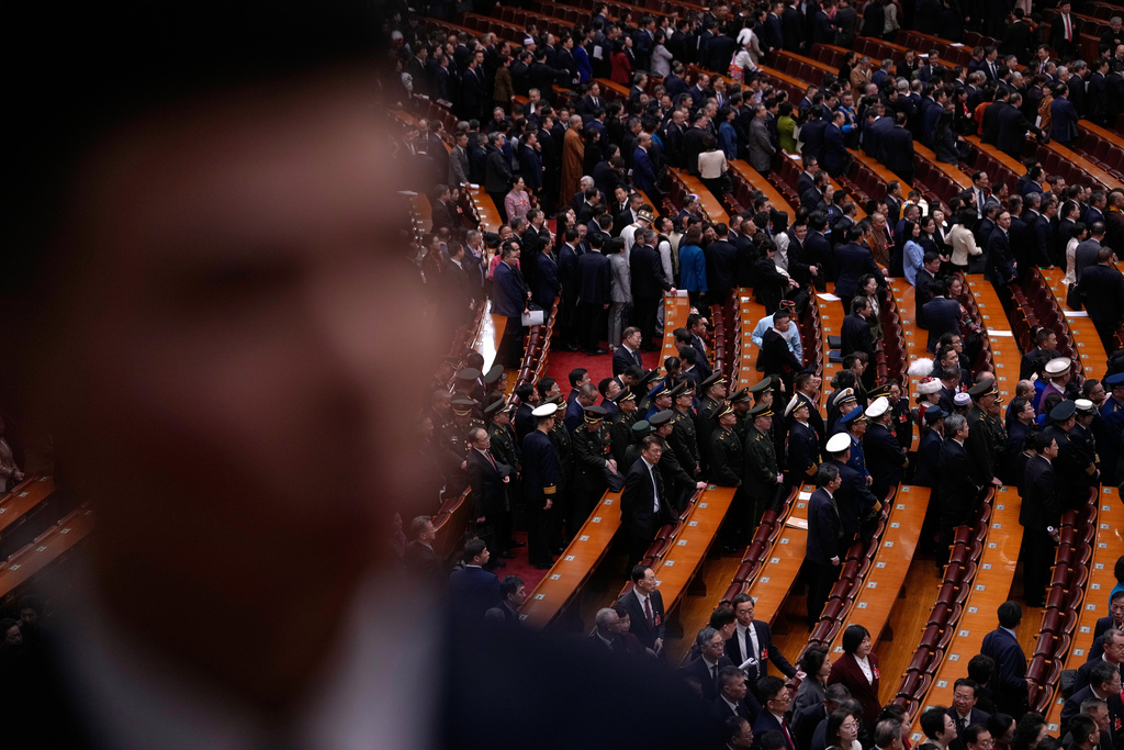 Delegates leave the hall after attending a plenary session of the National People's Congress (NPC) at the Great Hall of the People, in Beijing, Monday, March 9, 2026. (AP Photo/Andy Wong)
