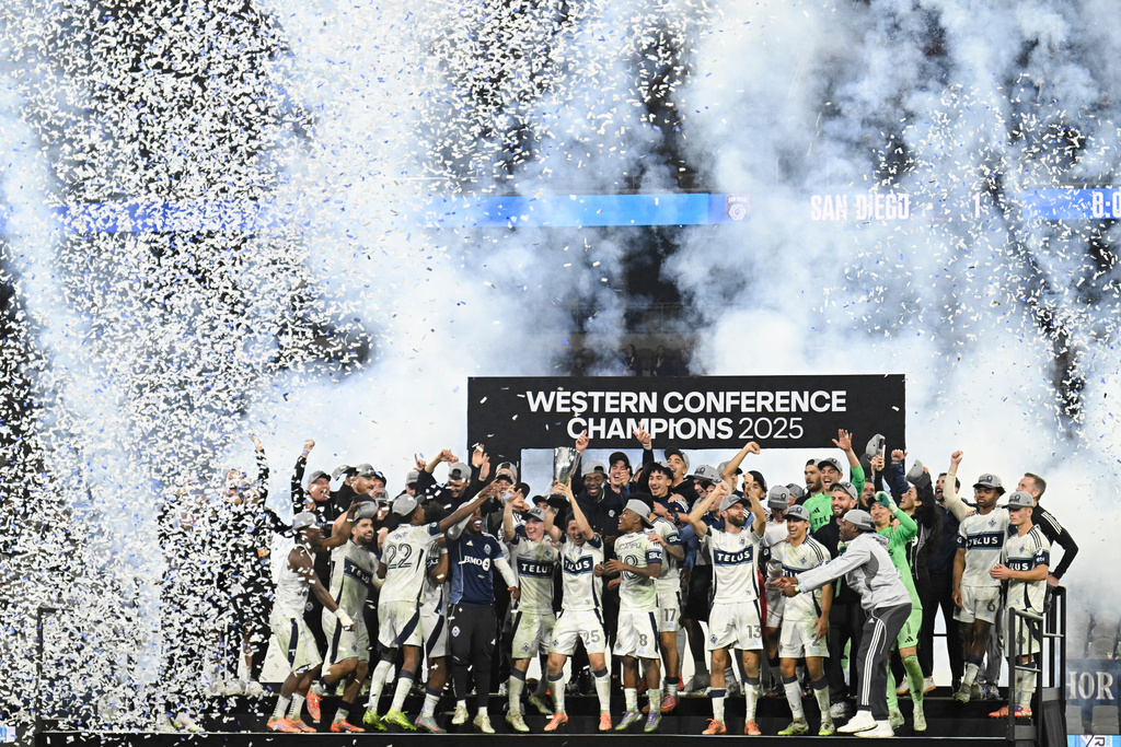 Vancouver Whitecaps players celebrate after winning the MLS Western Conference final soccer match against San Diego FC, Saturday, Nov. 29, 2025, in San Diego. (AP Photo/Denis Poroy)