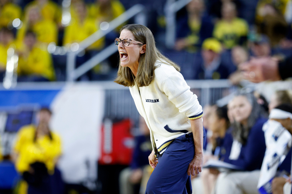 Michigan coach Kim Barnes Arico yells instructions against North Carolina State during the first half in the second round of the NCAA college basketball tournament, Sunday, March 22, 2026, in Ann Arbor, Mich. (AP Photo/Al Goldis)