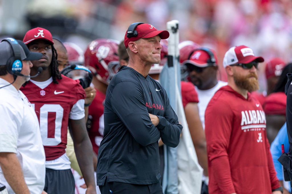 Alabama head coach Kalen DeBoer, center, looks on during the first half of an NCAA college football game against East Carolina, Saturday, Sept. 5, 2026, in Tuscaloosa, Ala. (AP Photo/Vasha Hunt)