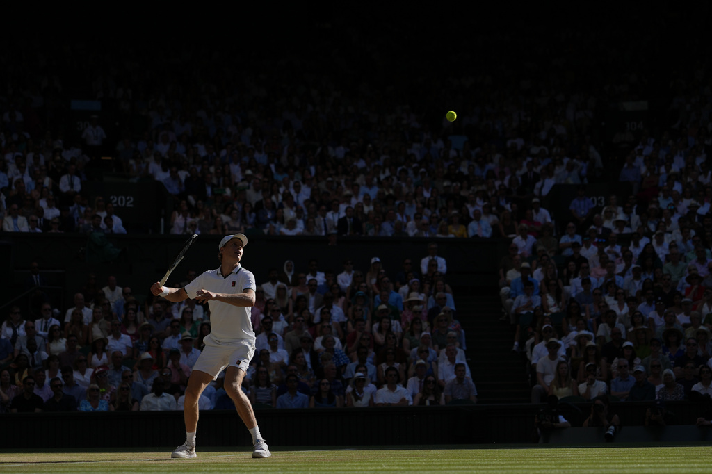 Jannik Sinner of Italy plays a return to Alexander Zverev of Germany men's singles final at Wimbledon Tennis Championships in London, Sunday, July 12, 2026. (AP Photo/Kin Cheung)