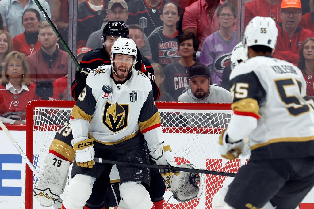 Vegas Golden Knights' Brayden McNabb takes a puck to the face during the first period in Game 2 of the NHL hockey Stanley Cup Final series against the Carolina Hurricanes in Raleigh, N.C., Thursday, June 4, 2026. (AP Photo/Karl DeBlaker)