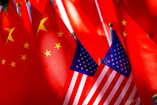 FILE - American flags are displayed with Chinese flags on Sept. 16, 2018, in Beijing. (AP Photo/Andy Wong, File) FILE - American flags are displayed with Chinese flags on Sept. 16, 2018, in Beijing. (AP Photo/Andy Wong, File)