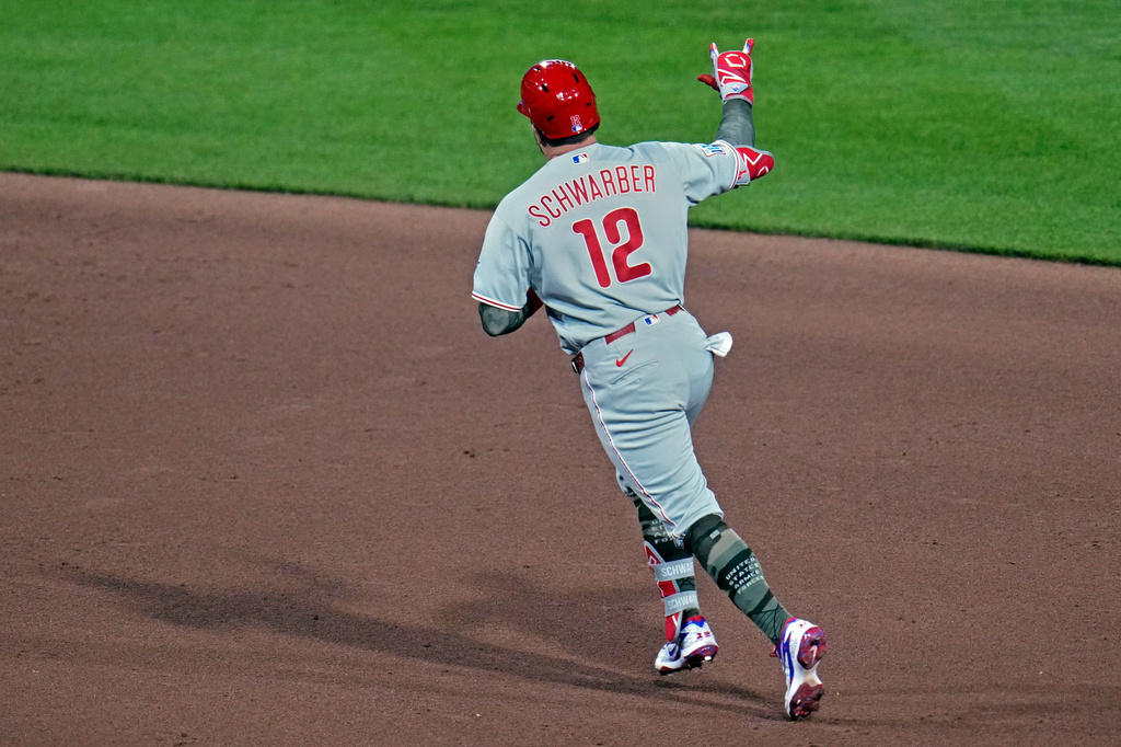 Philadelphia Phillies' Kyle Schwarber rounds the bases after hitting a two-run home run off Pittsburgh Pirates pitcher Mason Montgomery during the seventh inning of a baseball game in Pittsburgh, Friday, May 15, 2026. (AP Photo/Gene J. Puskar)