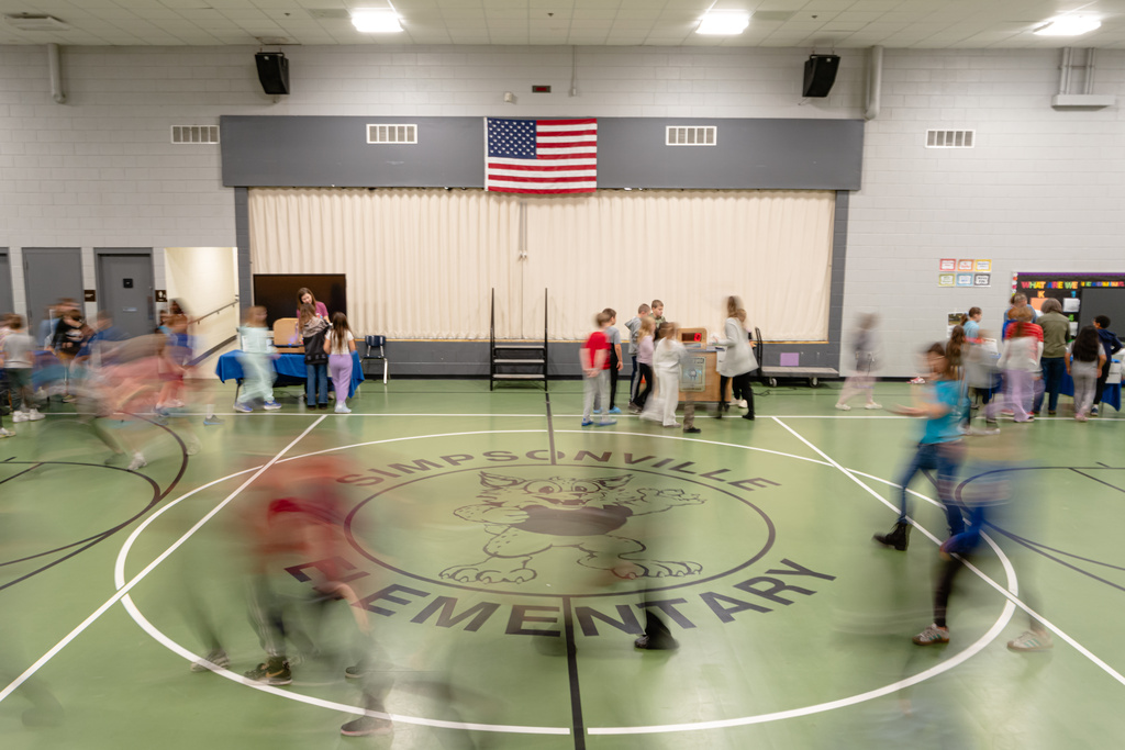 Students rotate stations during a science, technology, engineering and mathematics activity, facilitated by the Kentucky Science Center, in Simpsonville Elementary School, Nov. 18, 2025, in Simpsonville, Ky. (AP Photo/Jon Cherry)