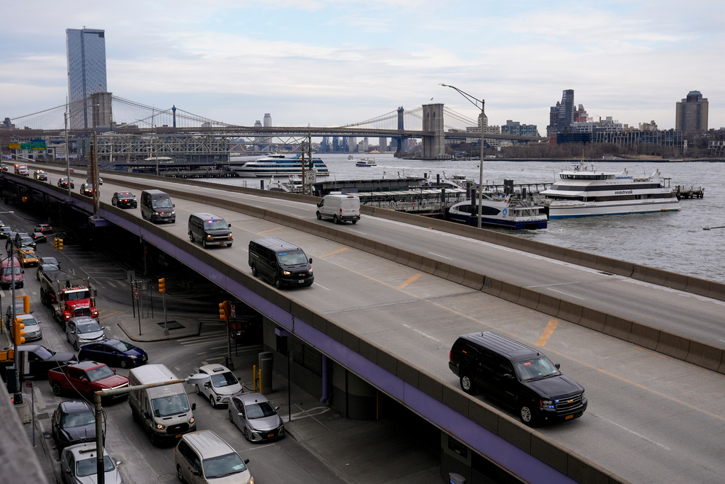 A motorcade makes its way down the FDR Drive after leaving Manhattan Federal Court where Venezuelan President Nicolas Maduro was arraigned with his wife Cilia Flores, Monday, Jan. 5, 2026, in New York. (AP Photo/Seth Wenig)