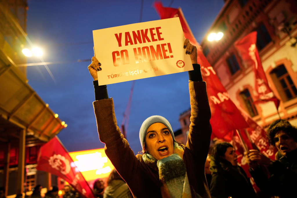 People shout slogans during a protest in Istanbul, Turkey, Sunday, Jan. 4, 2026, against a U.S. military attack that removed Venezuelan leader Nicolas Maduro from the country. (AP Photo/Emrah Gurel)