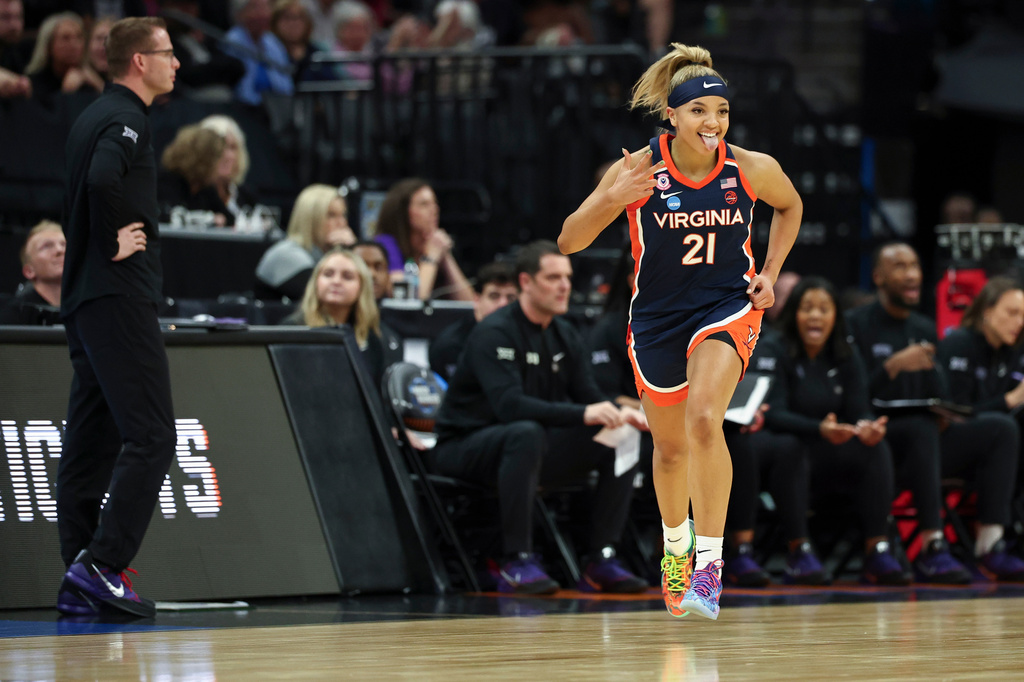 Virginia guard Kymora Johnson celebrates after making a 3-point basket during the first half against TCU in the Sweet 16 of the NCAA college basketball tournament Saturday, March 28, 2026, in Sacramento, Calif. (AP Photo/Sara Nevis)