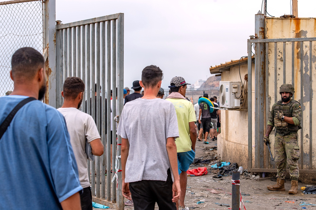 Migrants return to Morocco from the Spanish enclave of Ceuta, Friday, July 31, 2026. (AP Photo/Antonio Sempere)