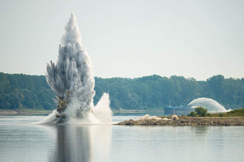 The Romanian Navy detonates underwater explosives during a controlled demolition of submerged rocks to improve water flow to the Cernavoda Nuclear Power Plant amid exceptionally low water levels on the Danube River, in Izvoarele, Romania, Monday, Aug. 3, 2026. (AP Photo/Andreea Alexandru)