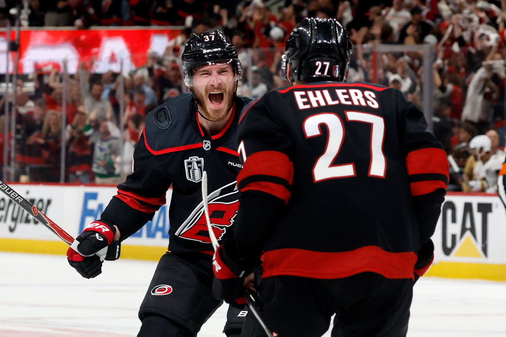 Carolina Hurricanes' Andrei Svechnikov (37) celebrates after his goal with Nikolaj Ehlers (27) during the second period in Game 5 of the NHL hockey Stanley Cup Final series against the Vegas Golden Knights in Raleigh, N.C., Thursday, June 11, 2026. (AP Photo/Karl DeBlaker)