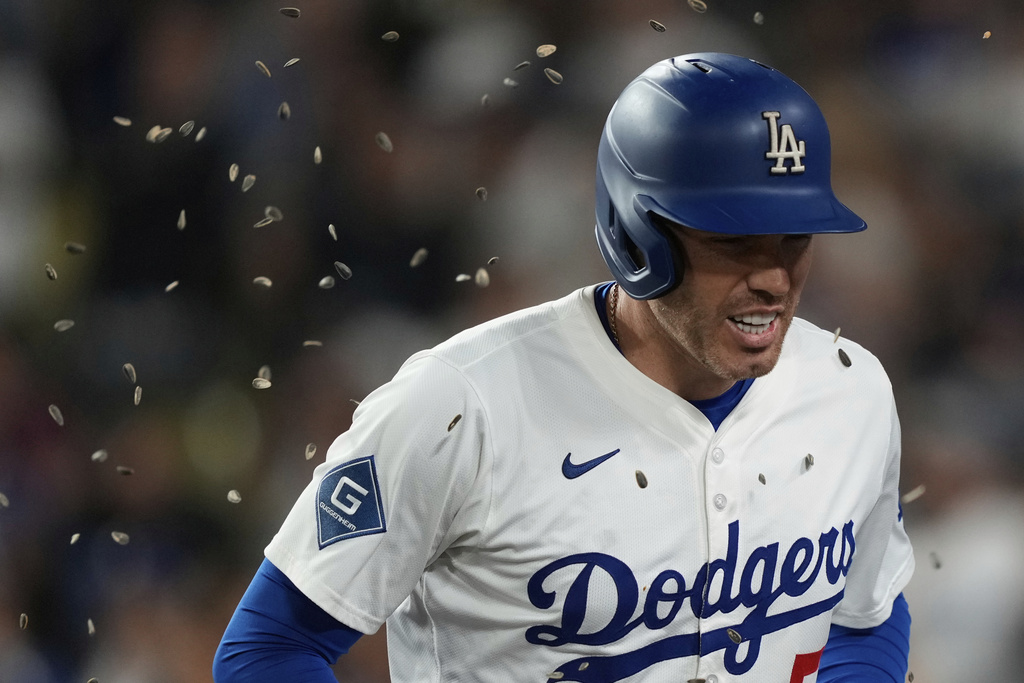 Los Angeles Dodgers' Freddie Freeman celebrates his home run during the second inning of a baseball game against the Philadelphia Phillies Wednesday, Sept. 17, 2025, in Los Angeles. (AP Photo/Mark J. Terrill)