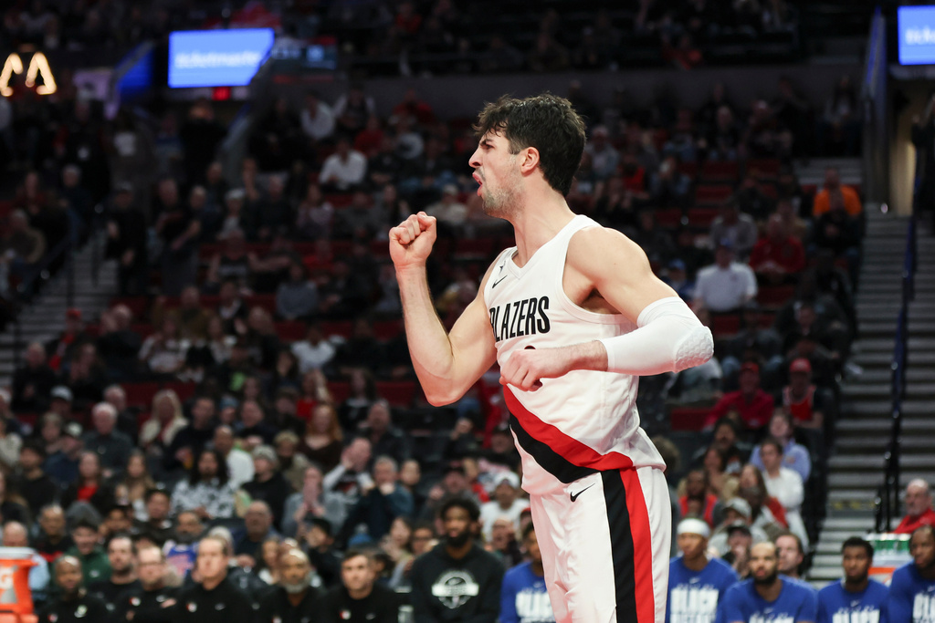 Portland Trail Blazers forward Deni Avdija reacts after scoring against the Philadelphia 76ers during the second half of an NBA basketball game, Monday, Feb. 9, 2026, in Portland, Ore. (AP Photo/Amanda Loman)
