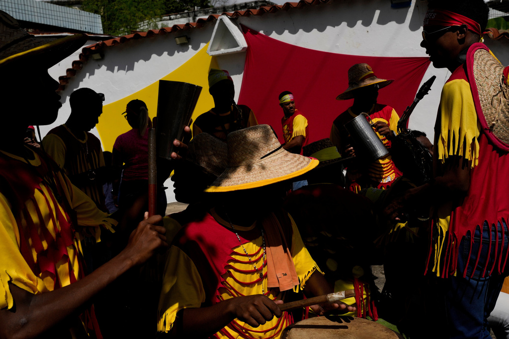 FILE - Revelers take part in the Afro-Venezuelan Holy Innocents' Day celebration in Caucagua, Venezuela, Dec. 28, 2025. (AP Photo/Matias Delacroix, File)