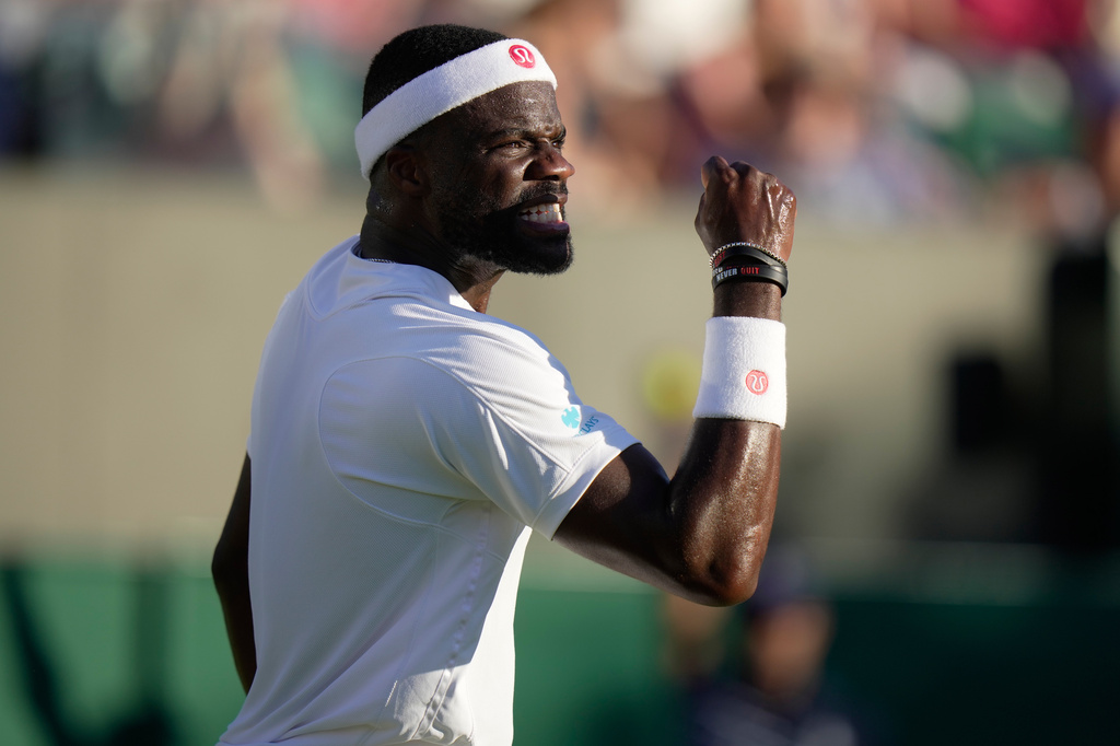 Frances Tiafoe of the United States reacts after winning a point against Jan Choinski of Britain in their second round men's singles match at the Wimbledon Tennis Championships in London, Thursday, July 2, 2026. (AP Photo/Brian Inganga)