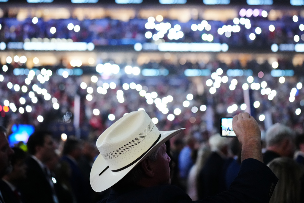 People stand as victims and first responders from Sept. 11 are honored at the Republican convention Thursday, Sept. 10, 2026, in Dallas. (AP Photo/Julia Demaree Nikhinson)
