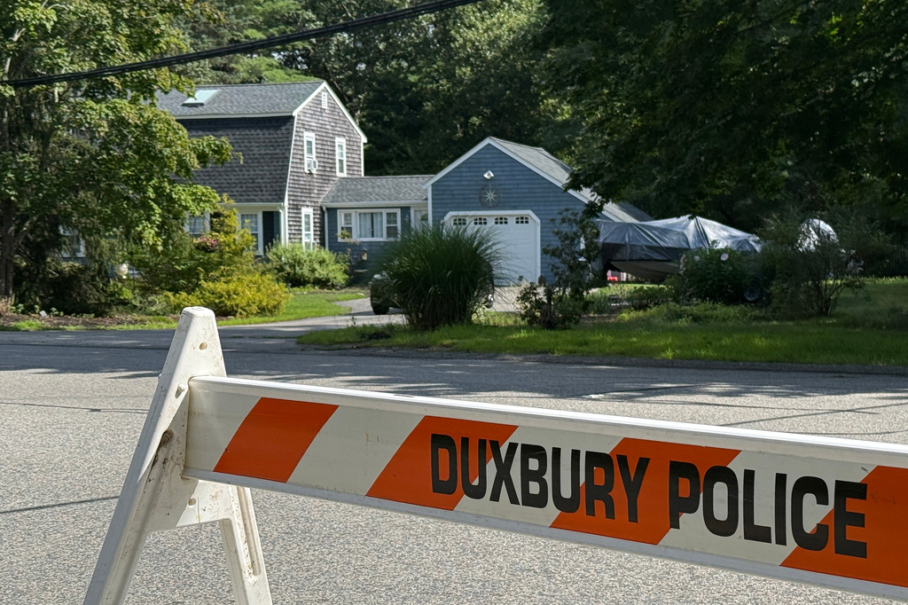 FILE - A police barricade stands outside the former home of Lindsay Clancy in Duxbury, Mass., July 31, 2026. (AP Photo/Rodrique Ngowi, File)